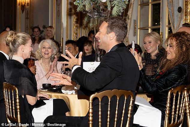 Pictured: Chris Martin, father of Apple Martin, lead singer of Coldplay, seen at his family's table during the event