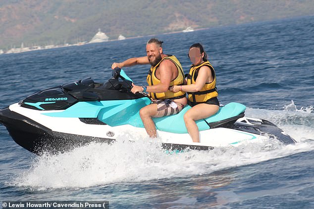 Howarth appeared to be enjoying his sunny holiday and was seen riding a jet ski, taking selfies with camels and driving a beach buggy in photos on social media