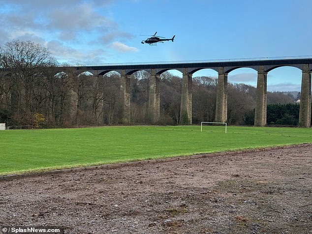 Cast and crew were seen navigating the Llangollen Canal on the 30 meter high aqueduct as helicopters monitored the scene from above