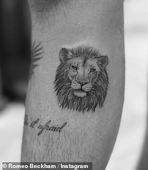 He also has a lion face on his arm above the words: 'Do it scared'