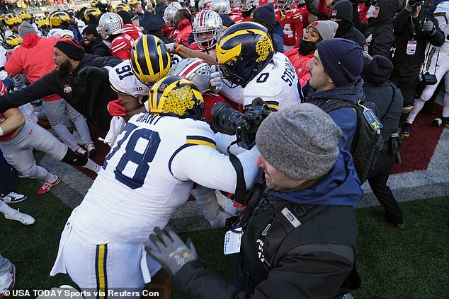 Michigan-Ohio State started the day with a violent brawl that started with a flag-planting incident