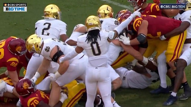 Notre Dame's Rylie Mills also threw a punch at a downed opponent during the game against USC