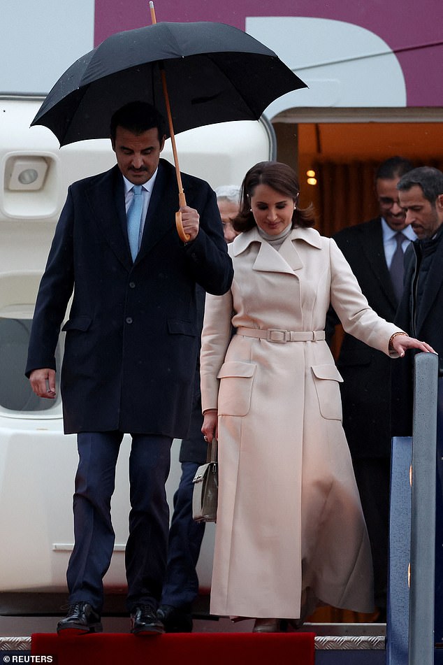 The Emir of Qatar, Sheikh Tamim bin Hamad al-Thani and his wife Sheikha Jawaher bint Hamad bin Suhaim Al-Thani, disembark their plane as they arrive for a state visit to Britain, at Stansted Airport near London.