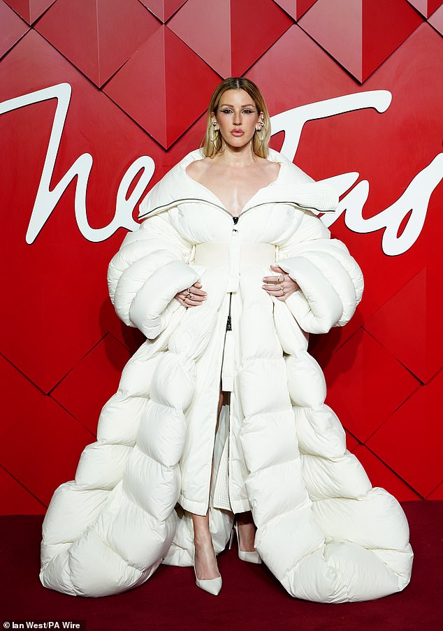 The 37-year-old singer stepped away from her usual style and donned a huge padded white coat that flowed to the floor for her moment in the spotlight.