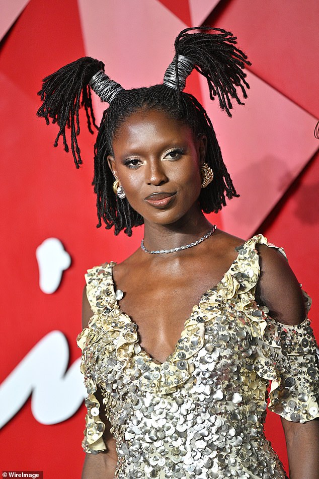 Jodie elevated her edgy look even further by pulling her braided hair into two quirky bunches on top of her head, secured with silver wire.