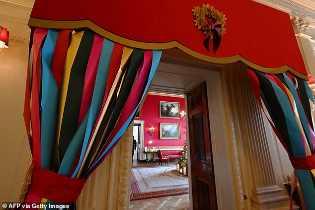 Multicolored ribbon hung around the doors and windows of the White House