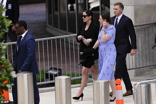 Naomi Biden (left), with husband Peter Neal, leaves father Hunter's trial in June