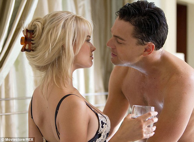 The Australian star revealed the two had to read a kiss scene when she decided a slap would be more dramatic. (Robbie and DiCaprio depicted in film)