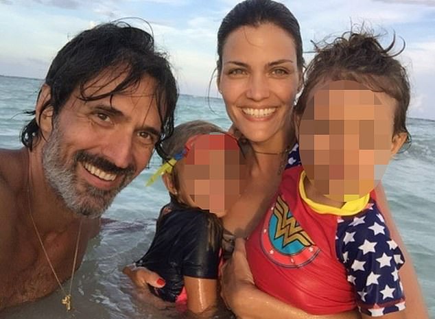 Luciana pictured with her husband and children in happier times