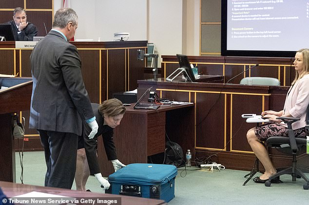 She demonstrated in court how she zipped up the suitcase with Torres still inside