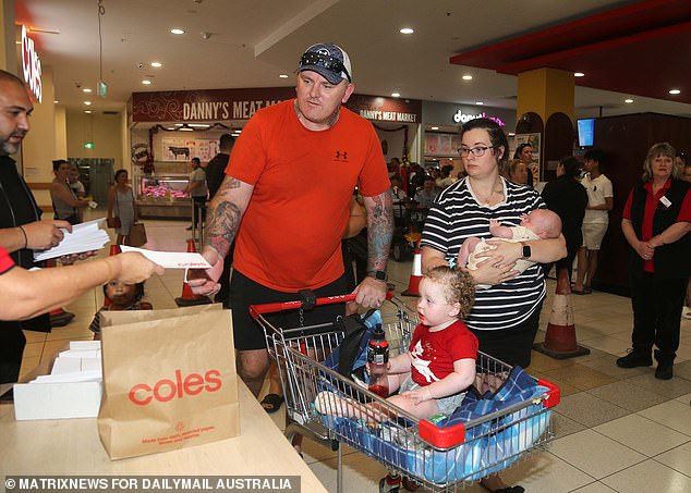 An Aussie family claims their Coles voucher courtesy of Adrian Portelli