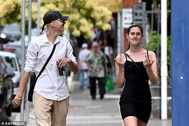 Christopher Carrig and Taylor Bayly, who have been dating for about three years, have matching tattoos behind their ears with the numbers 