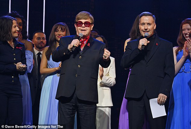 During the West End premiere on Sunday, Sir Elton took to the stage and spoke in an emotional speech about not being able to watch the performance after losing sight - before being led off stage by beloved husband David Funrish, 62 (right)