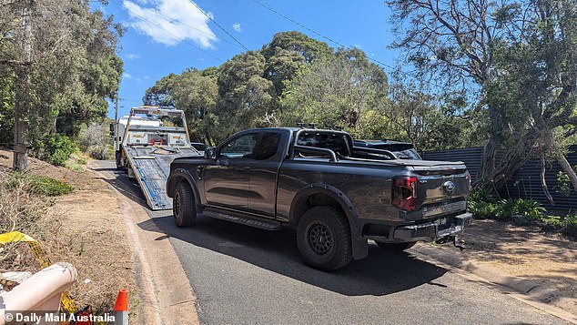 A black Ford Ranger was also removed from the scene