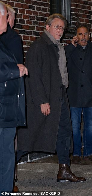 The movie star, who waved to fans as he left the set of the chat show, completed his look with brown leather boots