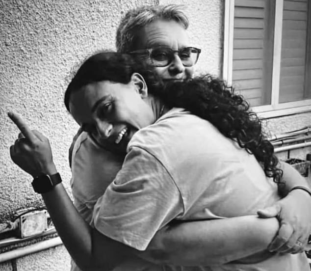 In a heartwarming photo, Mandy Damari is pictured hugging Emily before she was kidnapped