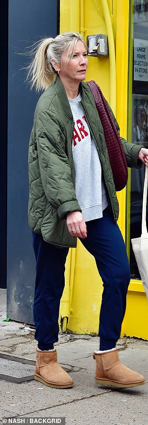 The actress wore a green padded jacket which she paired with a casual gray sweater and navy blue sweatpants