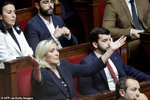 Chairman of the National Parliamentary Group Rassemblement Marine Le Pen gestures during the voting session on the draft of the Social Security Law 2025 in the National Assembly