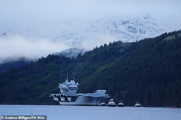 The Royal Navy aircraft carrier HMS Prince of Wales arrives at Glenmallen on Loch Long, Argyll and Bute, on 22 November