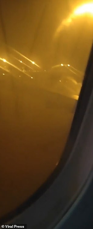 Images show the left wing of the plane going up in flames