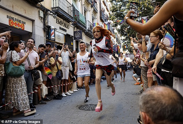 Participants take part in the High-Heels Race as part of the Pride celebrations, in Madrid's Chueca district on July 4 and 29, 2024