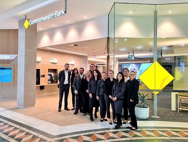 The photo shows workers at a Commonwealth Bank cashless branch in Penrith. Deposits and withdrawals can still be made via on-site ATMs