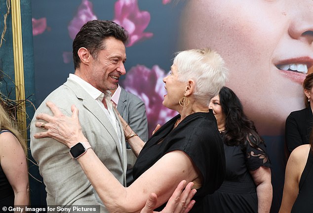 The Greatest Showman star got off to a 'traumatic' start when his own mother Grace left him as a child to start a new life in Britain. Pictured hugging Tammy Reynolds