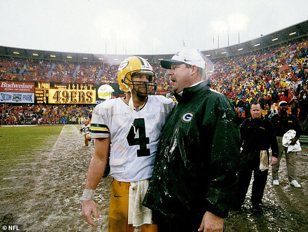 Green Bay Packers quarterback Brett Favre (4) talks with head coach Mike Holmgren as time expires in the NFC Championship Game, a 23-10 win over the San Francisco 49ers in 1998