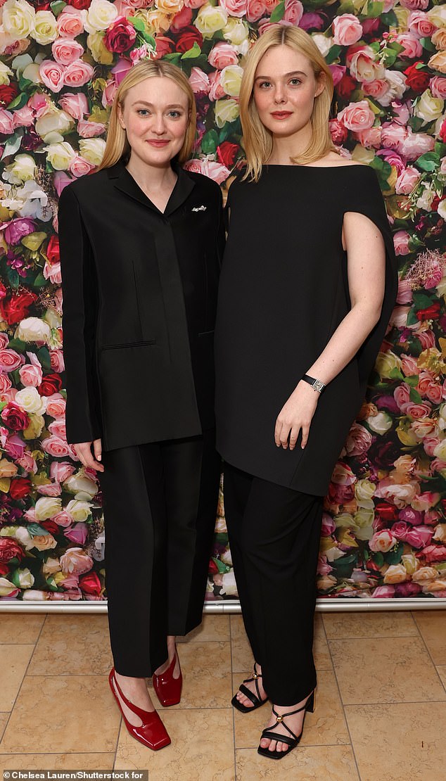 The elder Fanning (left) added a pop of color to her outfit with a geometric red heel