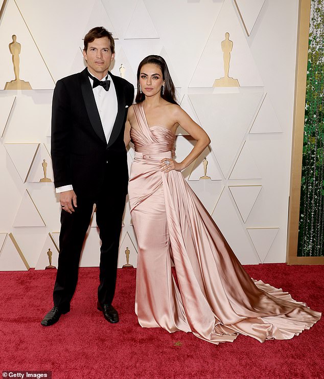 Ashton's wife Mila Kunis (seen with him in Hollywood in 2022) was not in the photo with him. They share two children: daughter Wyatt, 10, and son Dimitri, eight