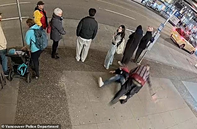 From another angle, the victim is seen lying flat on his back after the brutal attack