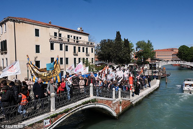 People protest against the introduction of the registration and tourist tax to visit the city of Venice for day trippers on April 25