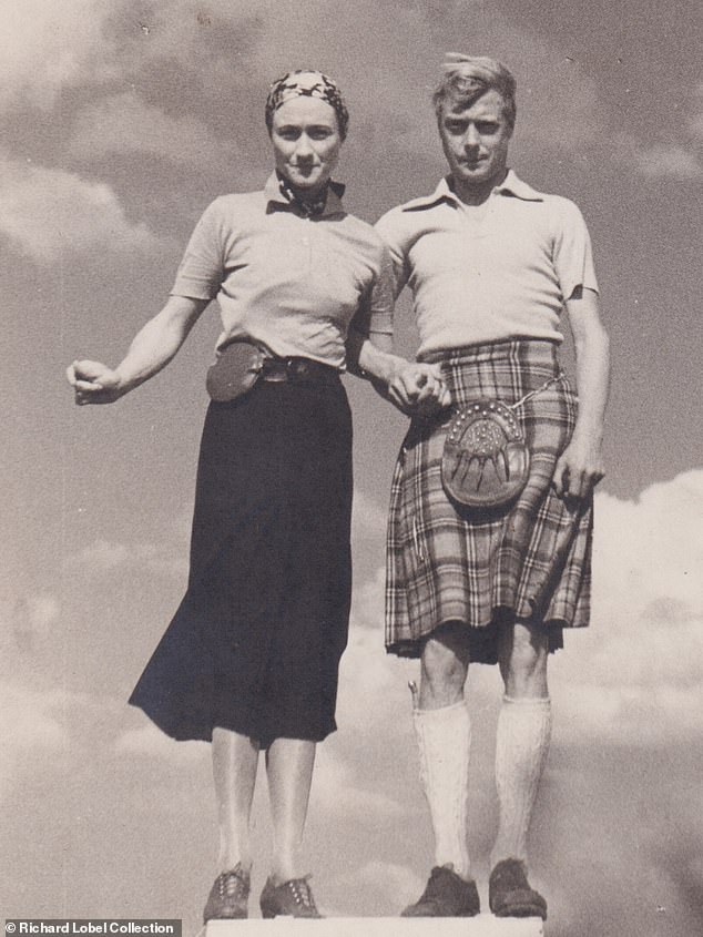 The Duke and Duchess of Windsor strike a bizarre, awkward pose while holding hands, summer 1937