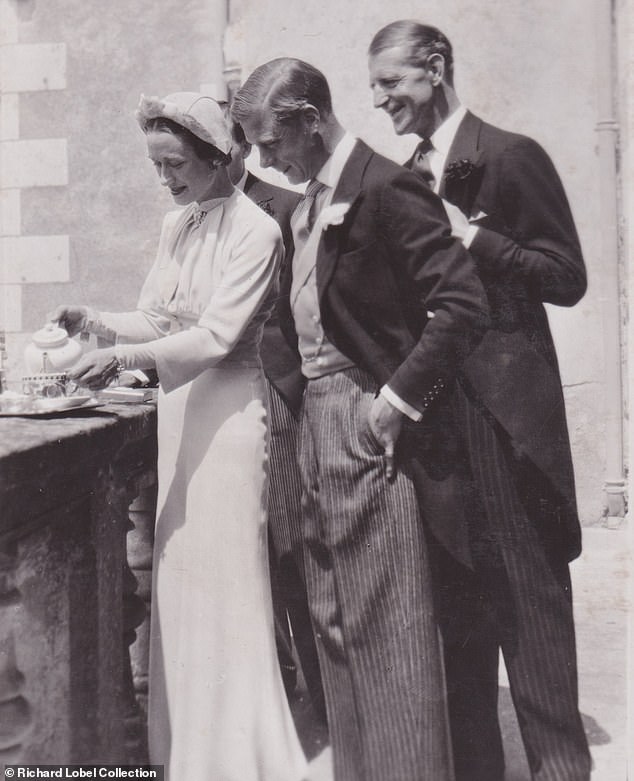 Wallis pours tea for her husband as his best man, Major Edward 'Fruity' Metcalfe, looks on