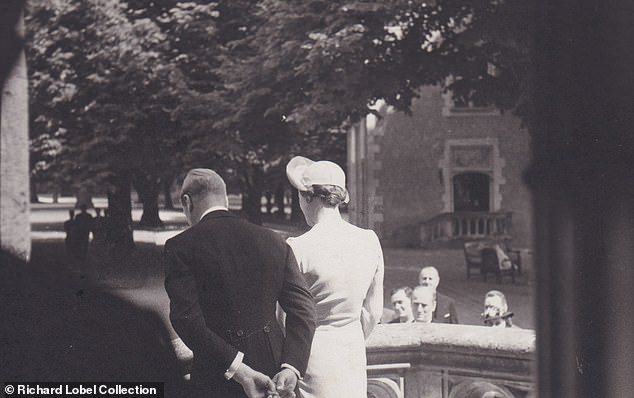 Edward and Wallis walk out after tying the knot in a low-key ceremony