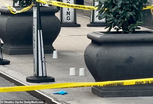 Shell casings covered with cups at the scene of the tragedy