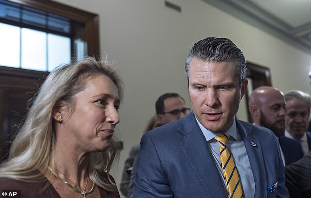 Hegseth and wife Jennifer Rauchet walk hand in hand on Capitol Hill on Tuesday as Donald Trump's pick for defense secretary met with senators ahead of next year's confirmation process