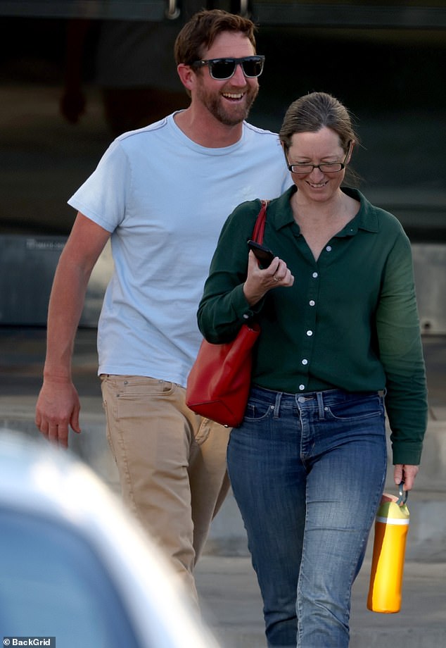 Taylor could be seen making her way through a parking lot as she made her way to a parked vehicle with her husband nearby