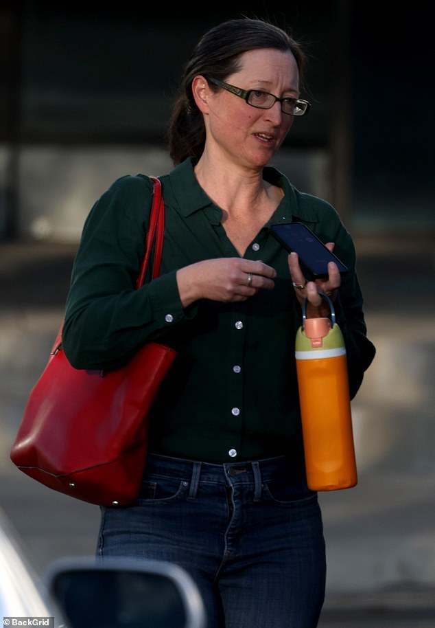 At one point, she flashed a small smile while having a quick conversation on her phone in the parking lot