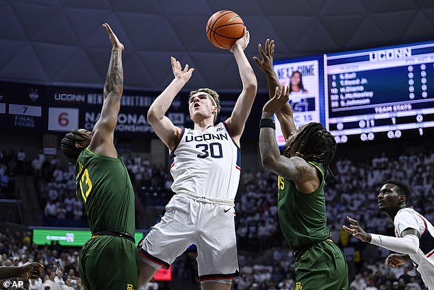 Freshman Liam McNeeley (30) led the Huskies on the night with 17 points and eight rebounds