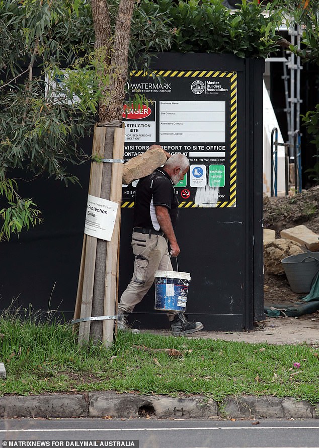 Workers are bringing in fresh sandstone blocks to supplement the historic sandstone already on site