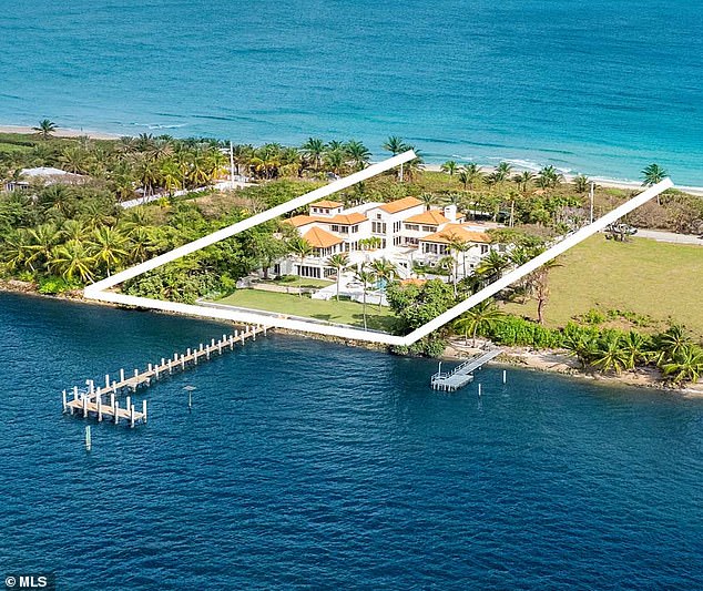 Built in 1990, the property is surrounded by palm trees and accompanied by a jetty with a new sea wall