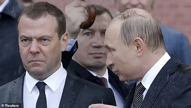 Former Russian President Dmitry Medvedev, now a top Kremlin security official, pictured with Vladimir Putin