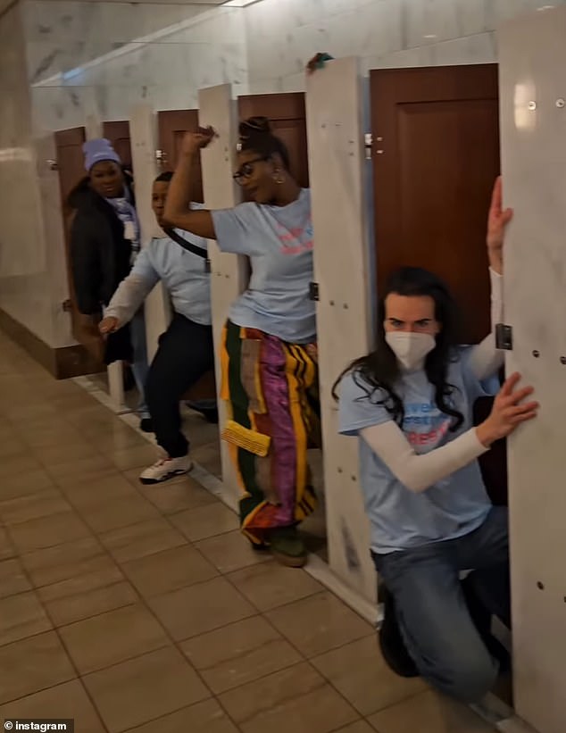 The group of demonstrators – including trans actress James Rose (right) – danced to Klymaxx's Meeting in the Ladies room