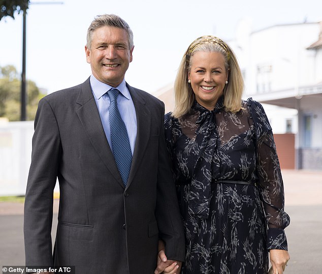 Her husband Richard has rarely accompanied her at public events over the years, but they notably stepped out together at Royal Randwick Racecourse for the 2021 races (pictured)