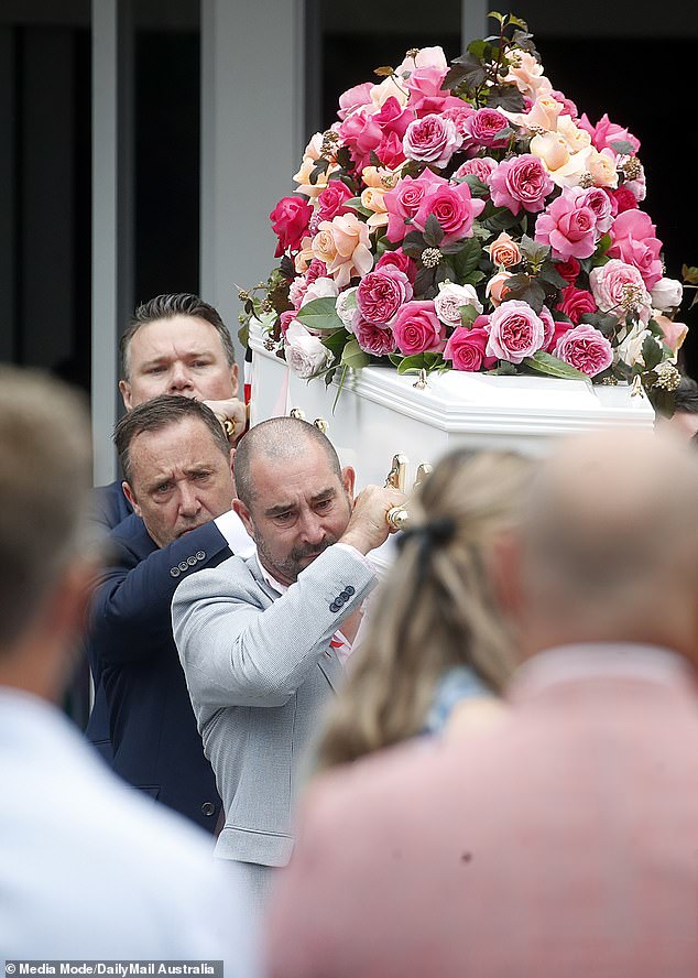 Bianca Jones' father Mark is seen with his daughter's coffin covered in pink roses. Holly Bowles' father is seen behind him