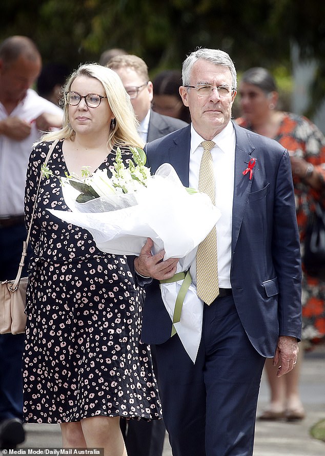 Attorney General Mark Dreyfus was pictured with a large bouquet of flowers (photo)