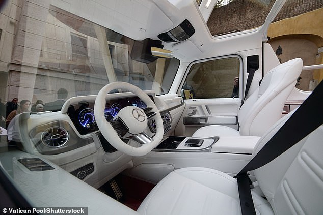 The pearly white popemobile is powered by an electric motor that is 