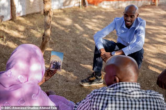 Sir Mo speaks to his brother Hassan and mother Aisha (pictured holding) during filming for BBC documentary The Real Mo Farah