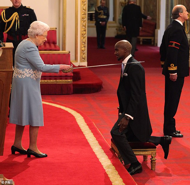 Sir Mo kneels as he is appointed Knight Bachelor of the British Empire by the Queen during a ceremony at Buckingham Palace in November 2017